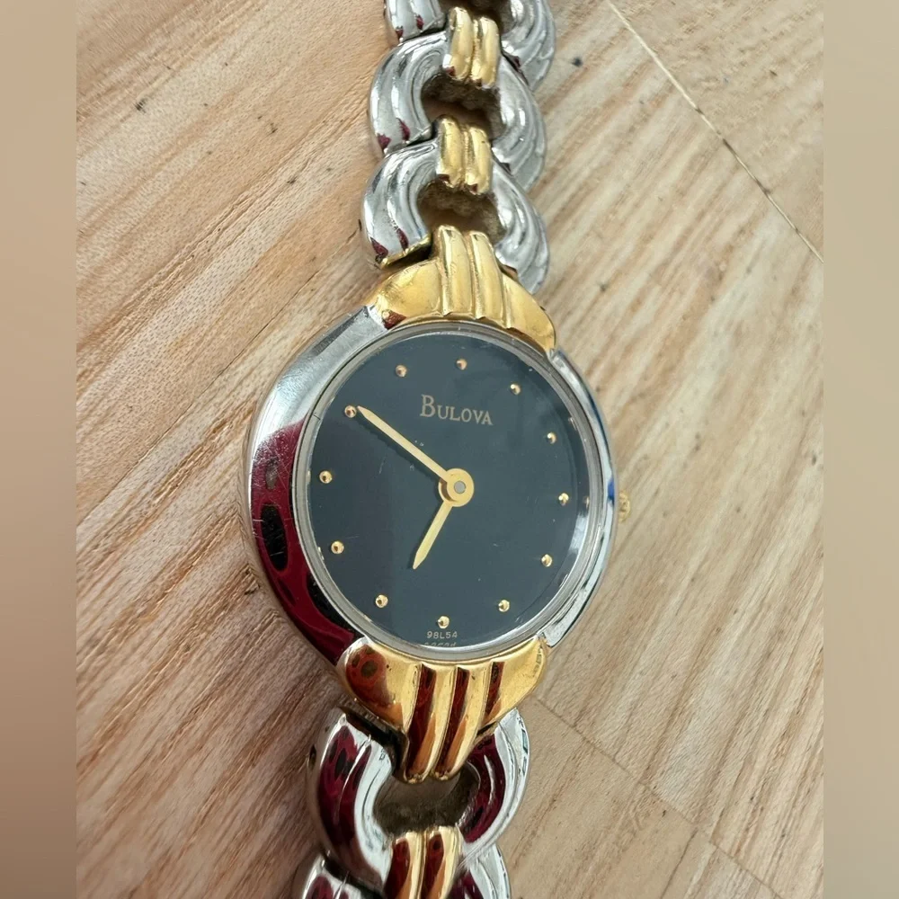 Bulova ladies black dial two toned dress watch NEW BATTERY